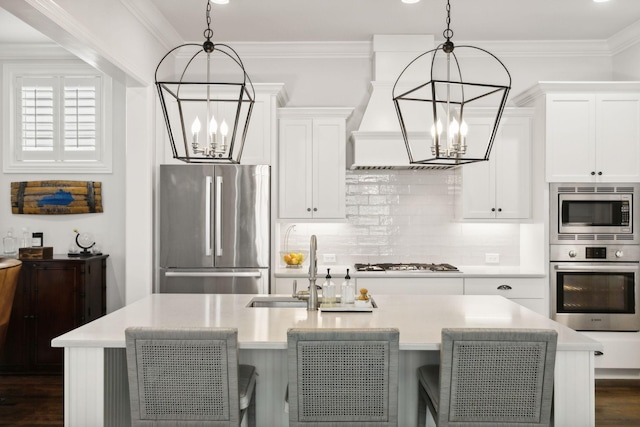 4091 Camberley St, Franklin, TN 37064 - kitchen with stainless steel appliances, a chandelier, a sink, light countertops, and ornamental molding