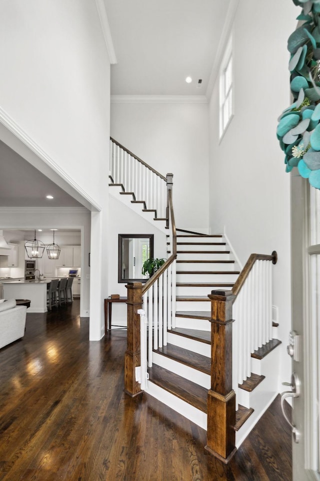 4091 Camberley St, Franklin, TN 37064 - staircase with ornamental molding, wood finished floors, a towering ceiling, and recessed lighting