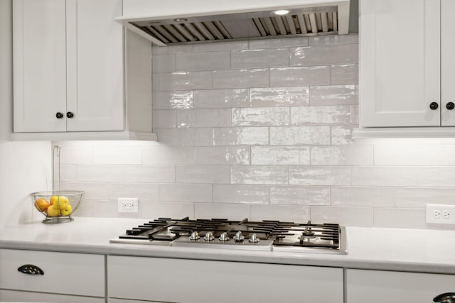 4091 Camberley St, Franklin, TN 37064 - kitchen featuring wall chimney exhaust hood, stainless steel gas stovetop, decorative backsplash, and light countertops