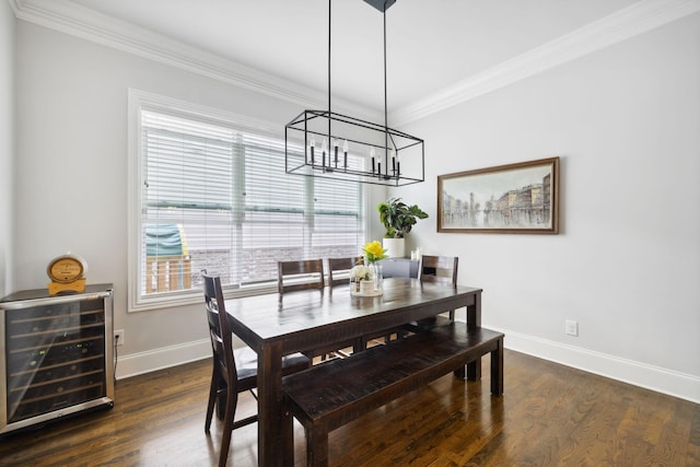 4091 Camberley St, Franklin, TN 37064 - dining area with beverage cooler, crown molding, baseboards, a chandelier, and wood finished floors