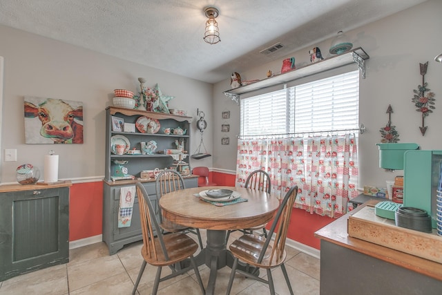 5064 Tricia Pl, Murfreesboro, TN 37129 - dining room featuring light tile patterned flooring, a textured ceiling, and baseboards