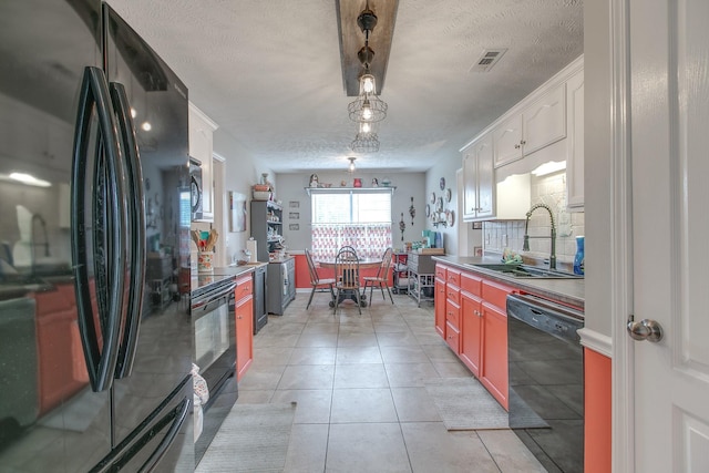5064 Tricia Pl, Murfreesboro, TN 37129 - kitchen with black appliances, a sink, a textured ceiling, white cabinets, and light tile patterned floors