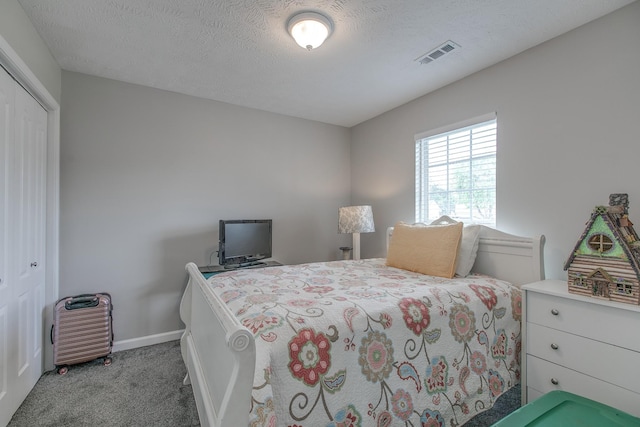 5064 Tricia Pl, Murfreesboro, TN 37129 - carpeted bedroom featuring a closet, baseboards, and a textured ceiling