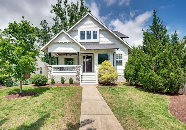 3610 Pilcher Ave, Nashville, TN 37209 - view of front of home with a porch, a front lawn, a ceiling fan, and a shingled roof