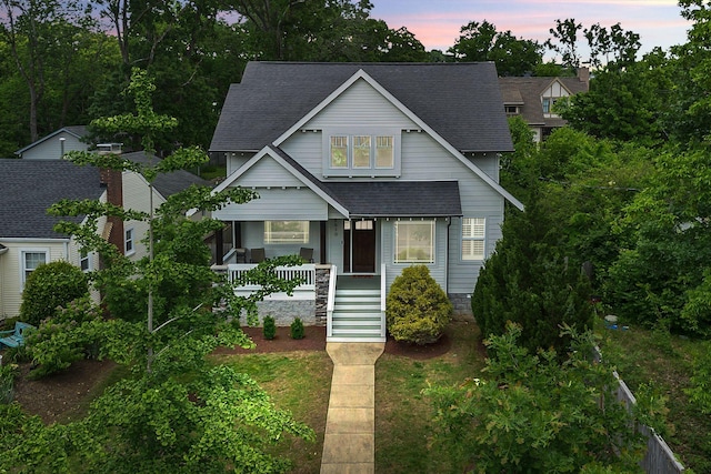 3610 Pilcher Ave, Nashville, TN 37209 - view of front facade with a shingled roof, a porch, and stairway