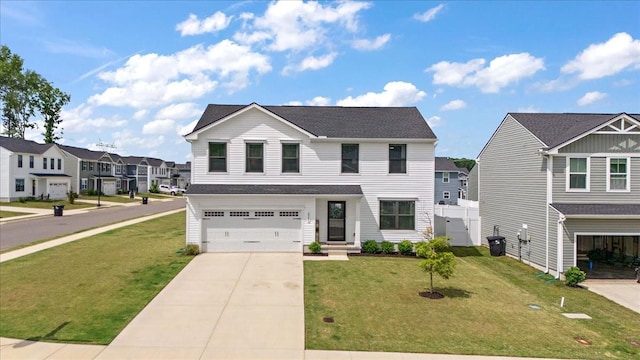 traditional home featuring an attached garage, a residential view, and concrete driveway