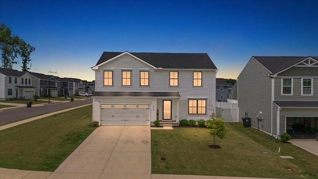 view of front of house featuring a garage, driveway, central AC unit, and a shingled roof