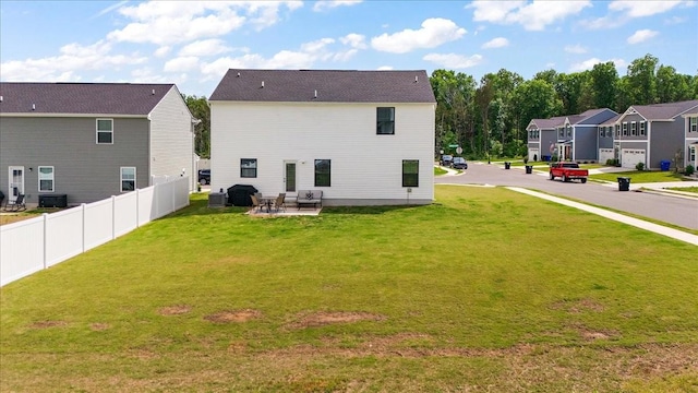 rear view of house with a patio area, a residential view, and central AC unit