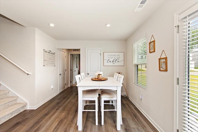 dining space with dark wood-style flooring, stairs, baseboards, and recessed lighting