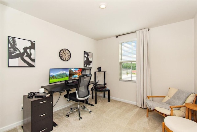 office space featuring light colored carpet and baseboards
