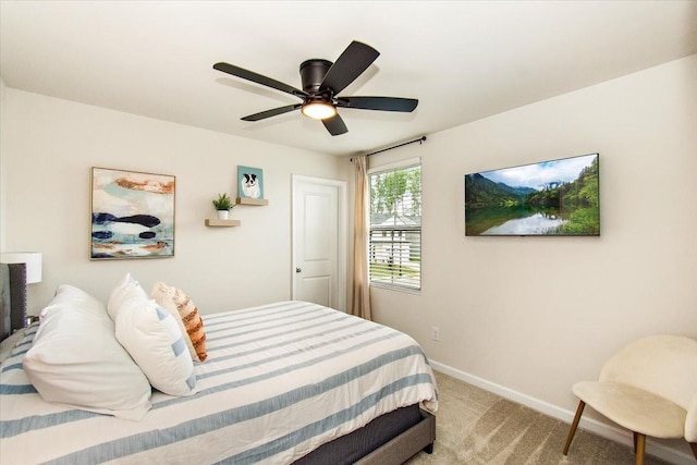 bedroom with baseboards, light carpet, and ceiling fan