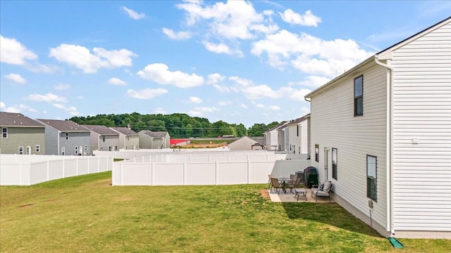 view of yard featuring a residential view and a patio area