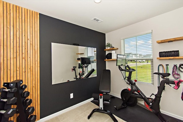 exercise room featuring baseboards