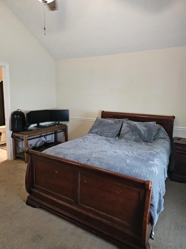 carpeted bedroom with vaulted ceiling