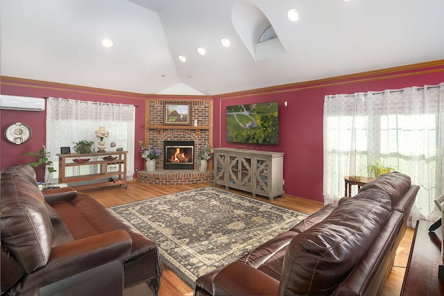 168 Maple Valley Ln, Cookeville, TN 38506 - living area featuring lofted ceiling, an AC wall unit, a fireplace, and wood finished floors