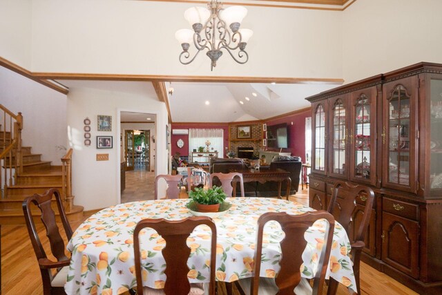 168 Maple Valley Ln, Cookeville, TN 38506 - dining space with stairs, a chandelier, high vaulted ceiling, light wood-type flooring, and recessed lighting