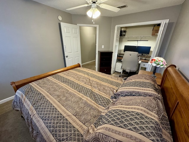 carpeted bedroom featuring baseboards, a closet, ceiling fan, and a textured ceiling