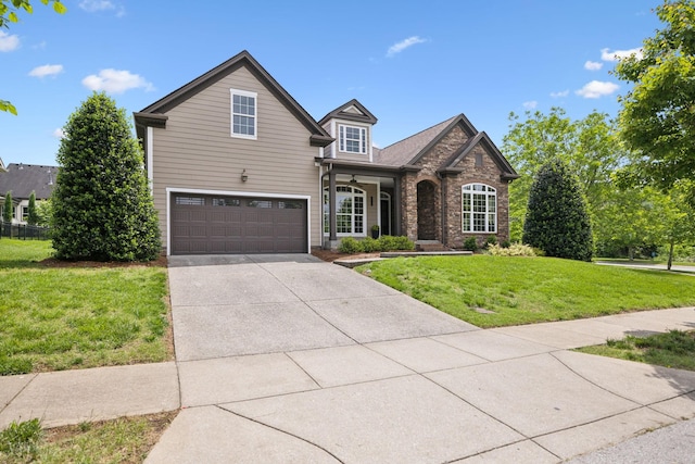 336 Alfred Ladd Rd E, Franklin, TN 37064 - traditional home featuring a front lawn, driveway, a garage, stone siding, and brick siding