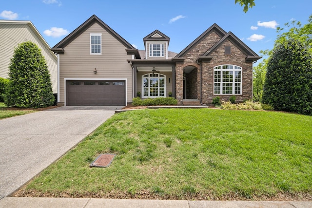336 Alfred Ladd Rd E, Franklin, TN 37064 - traditional-style house with an attached garage, driveway, a front yard, and stone siding