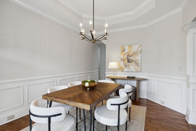 336 Alfred Ladd Rd E, Franklin, TN 37064 - dining area with a tray ceiling, a chandelier, wood finished floors, a decorative wall, and crown molding