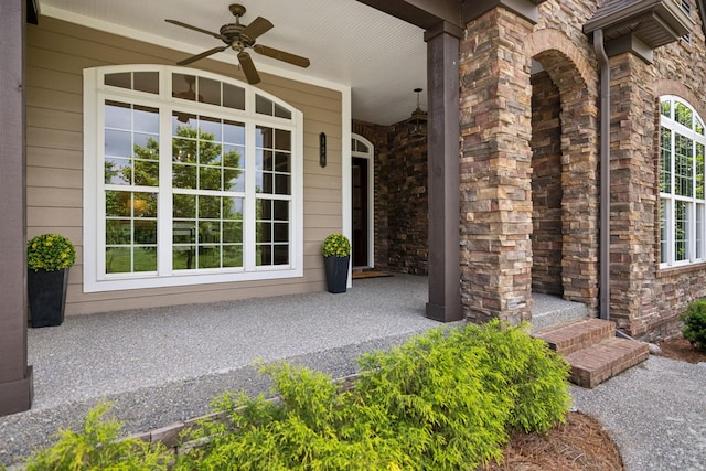 336 Alfred Ladd Rd E, Franklin, TN 37064 - property entrance with a porch, a ceiling fan, and stone siding