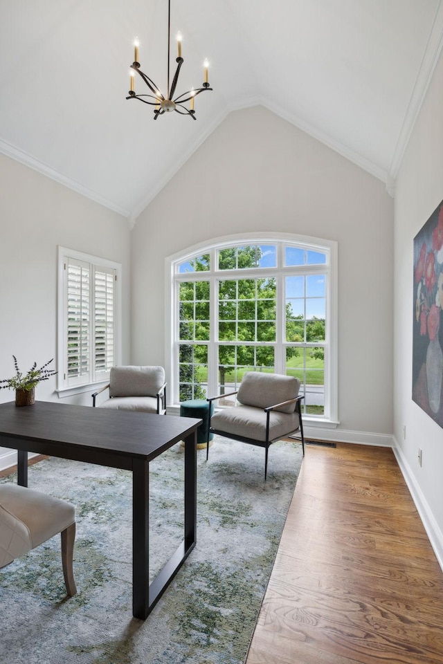 336 Alfred Ladd Rd E, Franklin, TN 37064 - living area with a chandelier, lofted ceiling, wood finished floors, and crown molding
