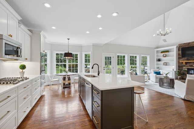 336 Alfred Ladd Rd E, Franklin, TN 37064 - kitchen with stainless steel appliances, a sink, white cabinetry, a chandelier, and recessed lighting