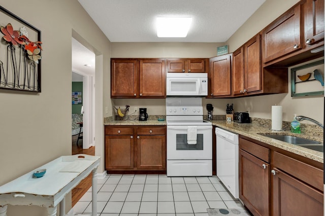 536 River St Unit 536, Chattanooga, TN 37405 - kitchen with white appliances, a sink, light tile patterned floors, light stone counters, and a textured ceiling