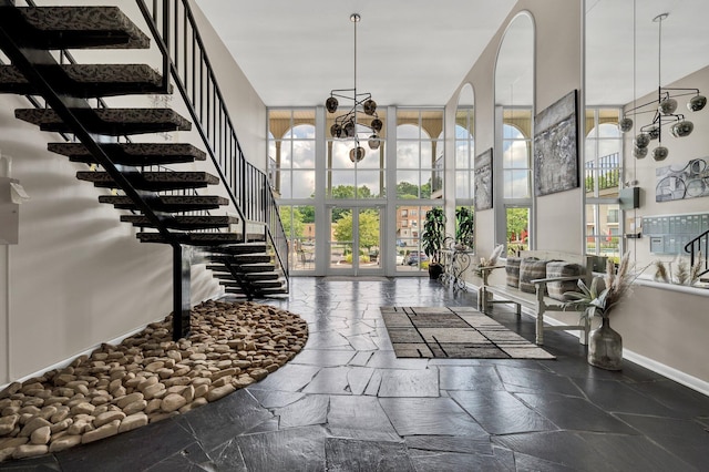 536 River St Unit 536, Chattanooga, TN 37405 - entryway with stone tile flooring, stairs, a high ceiling, and baseboards