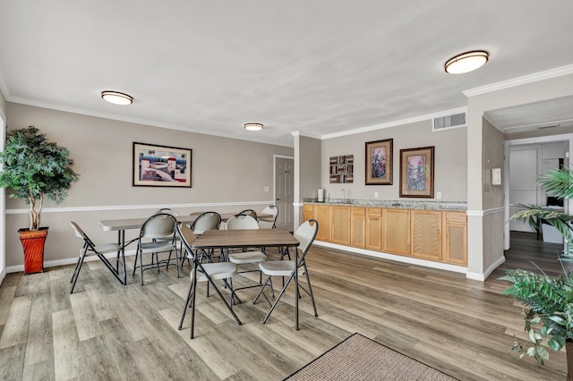 536 River St Unit 536, Chattanooga, TN 37405 - dining space featuring light wood-style flooring, crown molding, and baseboards