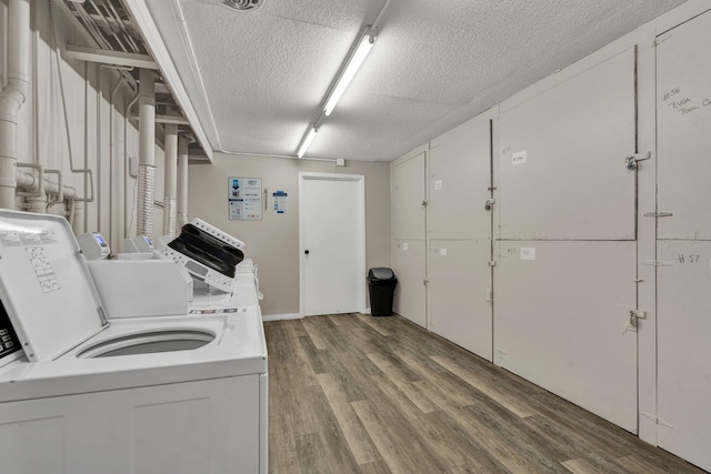 536 River St Unit 536, Chattanooga, TN 37405 - community laundry featuring a textured ceiling, washing machine and dryer, and light wood-style floors