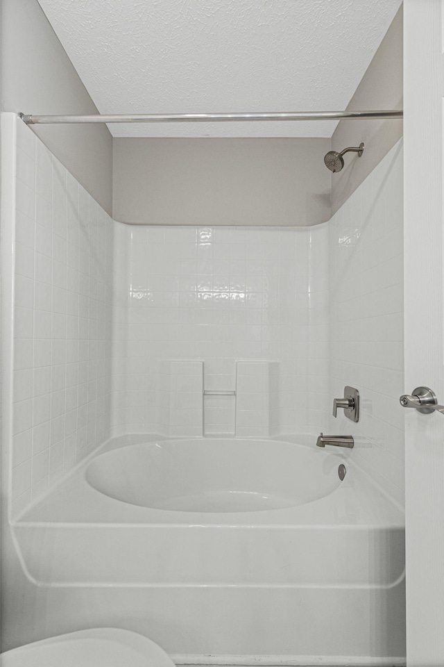 608 Flintlock Ct, Nashville, TN 37217 - bathroom featuring a textured ceiling, shower / bathtub combination, and toilet