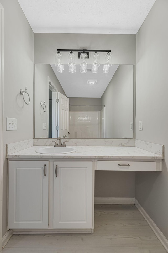 608 Flintlock Ct, Nashville, TN 37217 - full bath with vanity, a shower, wood finished floors, and baseboards