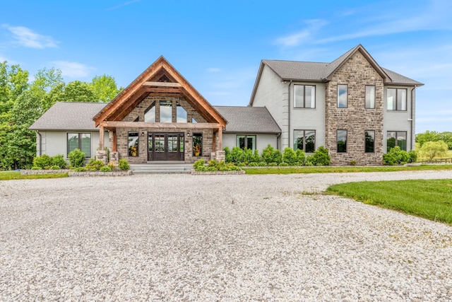 view of front of property with stone siding and a porch