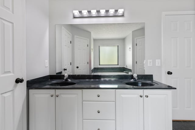 bathroom featuring double vanity