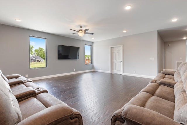 living room with ceiling fan, plenty of natural light, dark wood-style flooring, and recessed lighting