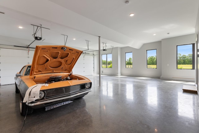 garage featuring recessed lighting and a garage door opener