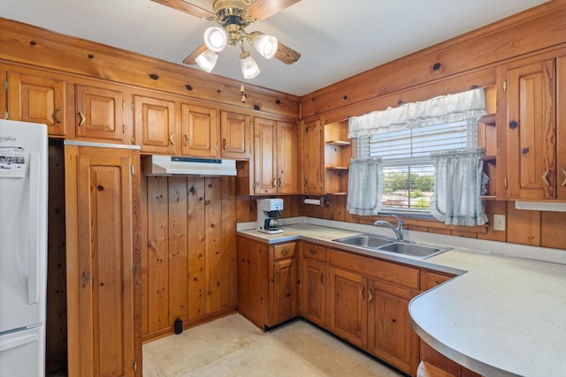 461 Annex Ave, Nashville, TN 37209 - kitchen with fridge, under cabinet range hood, brown cabinets, a sink, and open shelves