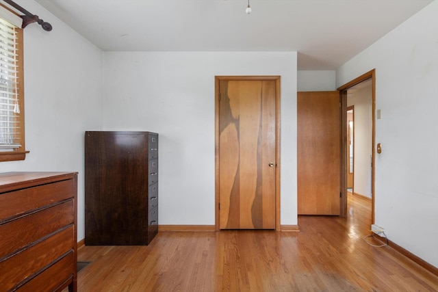 461 Annex Ave, Nashville, TN 37209 - unfurnished bedroom featuring light wood-type flooring and baseboards