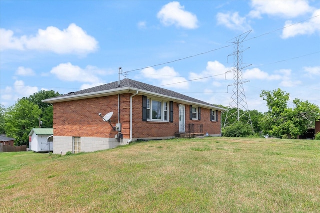 461 Annex Ave, Nashville, TN 37209 - rear view of house with brick siding, a yard, and a storage shed