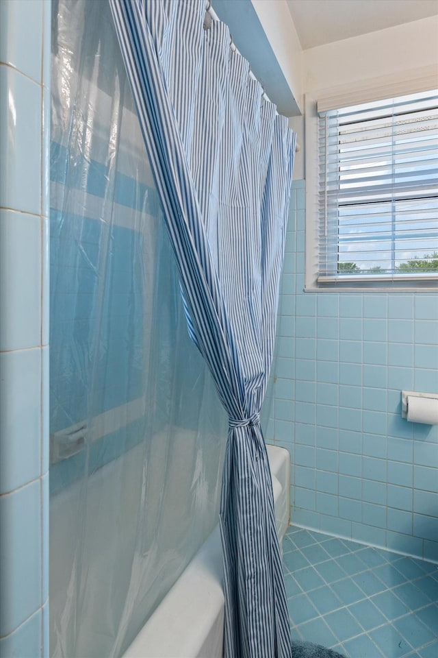 461 Annex Ave, Nashville, TN 37209 - full bath with tile walls, a shower with shower curtain, toilet, and tile patterned floors