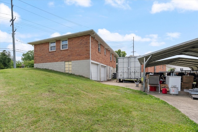 461 Annex Ave, Nashville, TN 37209 - view of side of home featuring brick siding, a lawn, an attached garage, and a carport
