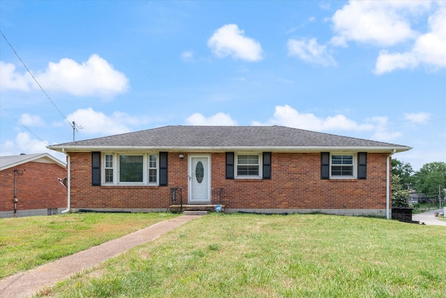 461 Annex Ave, Nashville, TN 37209 - view of front facade featuring brick siding, a front lawn, and a shingled roof