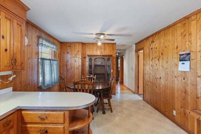 461 Annex Ave, Nashville, TN 37209 - dining area featuring light floors, wooden walls, and a ceiling fan
