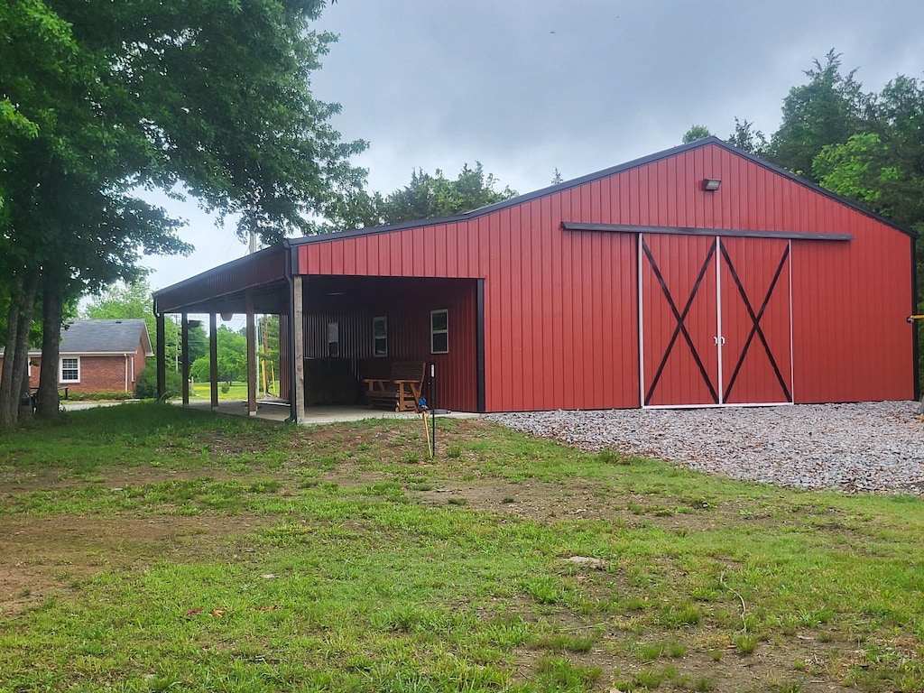 1120 Weeks Rd, Murfreesboro, TN 37127 - view of pole building featuring a yard