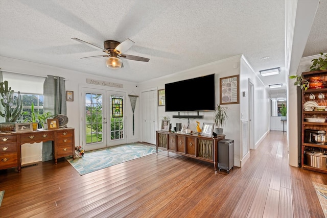 1120 Weeks Rd, Murfreesboro, TN 37127 - living area with hardwood / wood-style floors, ceiling fan, a textured ceiling, french doors, and crown molding