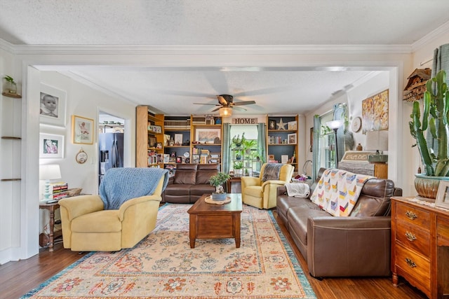 1120 Weeks Rd, Murfreesboro, TN 37127 - living area with wood finished floors, a textured ceiling, ceiling fan, crown molding, and built in shelves