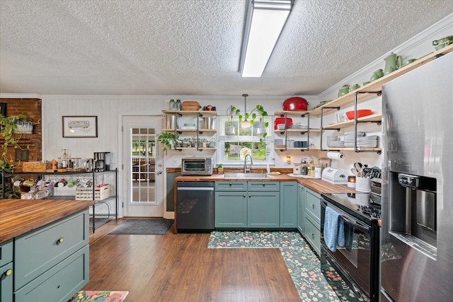 1120 Weeks Rd, Murfreesboro, TN 37127 - kitchen featuring wood counters, appliances with stainless steel finishes, a sink, open shelves, and crown molding