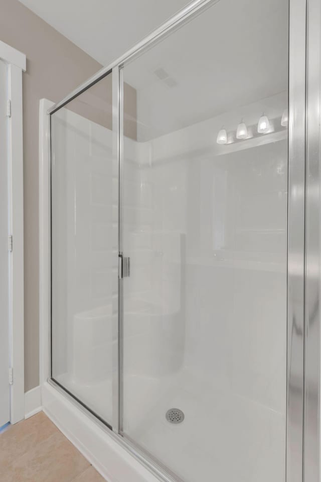 full bathroom featuring a stall shower