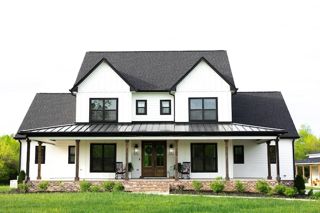 1325 Rogers Ln, Lebanon, TN 37087 - view of front of home featuring a standing seam roof, covered porch, board and batten siding, and metal roof